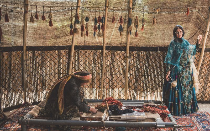 Tribal rug weaving women
